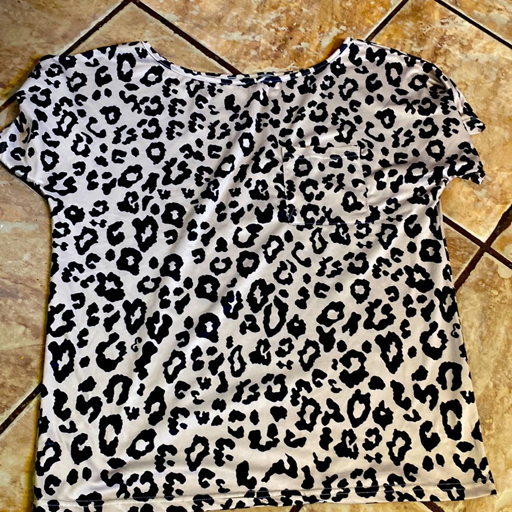 Leopard print off shoulder loose fit shirt.